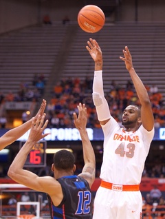 Forward James Sutherland rises above the DePaul defender to attempt a shot.