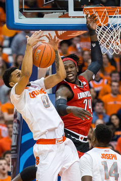 Michael Gbinije tries to corral the ball near the rim against Cardinals forward Montrezl Harrell. Gbinije had 10 points on 4-of-8 shooting in the opening 20 minutes.