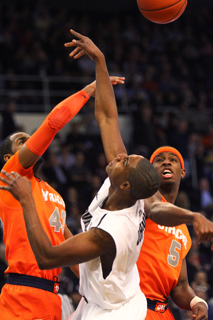 C.J. Fair helps swat a ball away from Providence forward Sidiki Johnson in Syracuse's 72-66 win over the Friars on Wednesday. Fair gave the Orange a boost in the low post, finishing with 23 points and four blocks. 