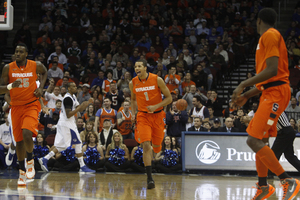 Michael Carter-Williams jogs up the court in Syracuse's 76-65 win over Seton Hall.