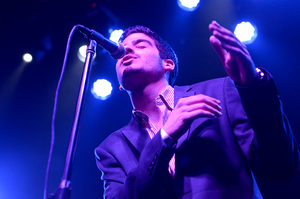 Gerardo Munguia, a senior management major and lead singer of The Monk, croons to the crowd at The Wescott Theater.