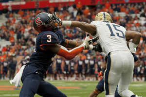 Devin Street stiff arms Syracuse safety Durell Eskridge in the face during one of the Pittsburgh wide receiver's few plays during Saturday's game.