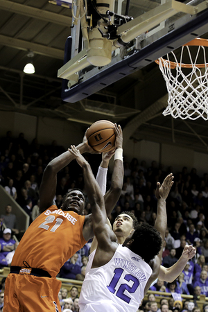 Syracuse forward Tyler Roberson attacks the basket over Duke's Justise Winslow (12) on Saturday night at Cameron Indoor Stadium.