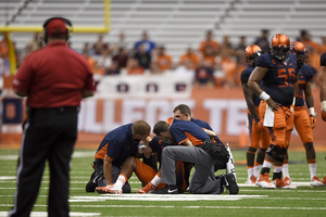 Terrel Hunt is tended to by trainers following his injury on Friday night. He won't return this season. 