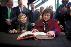 Stephanie Miner signs the oath of office registry in the City Hall Commons Atrium during her swearing in ceremony on Jan. 18, 2014 for her second term. Miner is now pushing to raise minimum wage for city employees to $15 per hour.