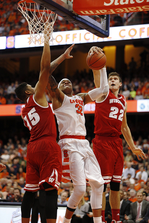 Dajuan Coleman fights for a rebound against Wisconsin on Wednesday night. Syracuse was outrebounded by 26 in its first loss of the season.