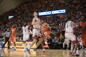 Boston College's Matt Milon looks for a rebound. Milon and Dennis Clifford torched the Orange on Sunday for a combined 41 points.