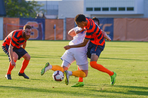 Hugo Delhommelle and Djimon Johnson fight for a ball against Hofstra. 