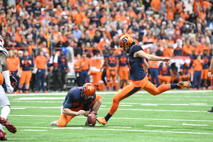 Andre Szmyt became SU's all-time points leader with a PAT in the fourth quarter.