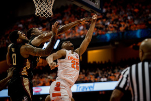 Tyus Battle lays the ball up under the rim.