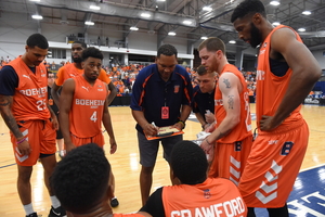 Head coach Ryan Blackwell talks to his players during a timeout of BA's first game in TBT 2019.