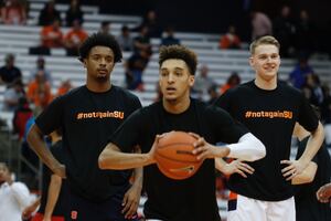 Elijah Hughes, Brycen Goodine and Buddy Boeheim sport #NotAgainSU warm-ups.