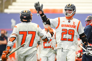 Stephen Rehfuss celebrates a goal with Owen Hiltz. Hiltz notched four goals against Stony Brook.