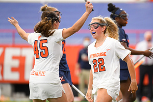 Megan Carney (right) set her career-high with seven goals against Louisville on Friday. 