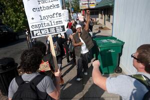 Protesters march through South Crouse Avenue with signs denouncing the corporate practices of big businesses, social and economic inequality and the effect of lobbyists on the government. Similar protests have swept through Chicago, San Diego and San Francisco.  