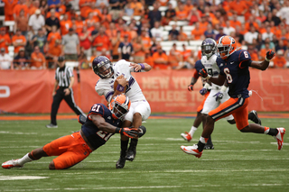 Northwestern quarterback Kain Colter is taken down by Shamarko Thomas after scrambling.