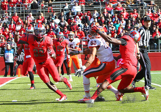 Syracuse wide receiver Jarrod West loses his balance as he battles Rutgers defensive back Logan Ryan.