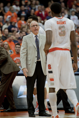 Jim Boeheim coaches Jerami Grant as he walks to the bench.