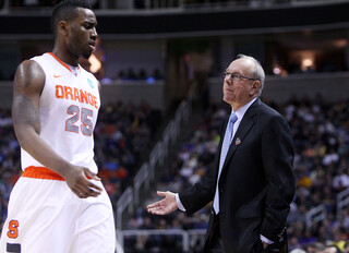 Jim Boeheim addresses Rakeem Christmas as he comes off the court.