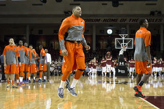 DaJuan Coleman warms up prior to Syracuse's 9 p.m. bout with Boston College on Monday night. Coleman would go on to sit out another game with a left leg contusion. 