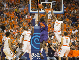 Grant attempts to block Nnoko's shot in the first half. 