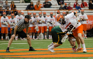 Mike Iacono takes a faceoff for Syracuse. 