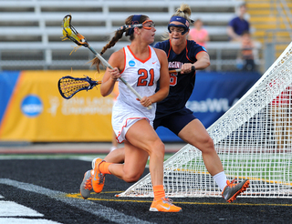 Syracuse attack Kayla Treanor works on Virginia's Morgan Stephens, who drew the difficult task of guarding the Orange's Tewaaraton Award finalist.