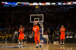 Christmas, Joseph and Gbinije react after McCullough made the first of two free throws with just more than eight seconds left.