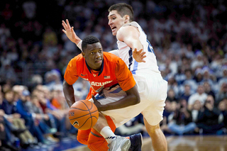 Kaleb Joseph tries to make a pass around Villanova's Ryan Arcidiacono. SU's freshman point guard had half as many turnovers as he did against Louisiana Tech.