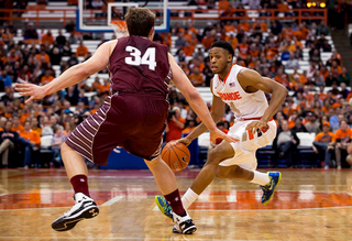 Sophomore Ron Patterson looks to attack with John Fenton defending. Patterson finished with 13 points and four assists.