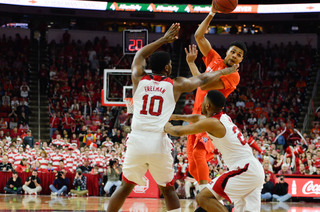 Michael Gbinije looks to pass down low during the first half. The junior forward had 10 points, five rebounds and five assists in the game.