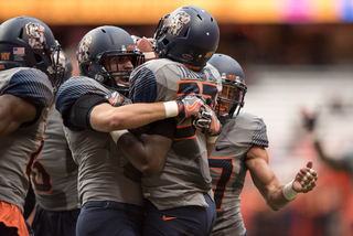 Linebacker Ted Taylor (37) received a hug from a teammate.