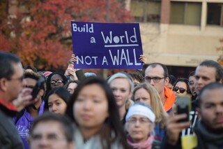 A protester holds a sign that says 