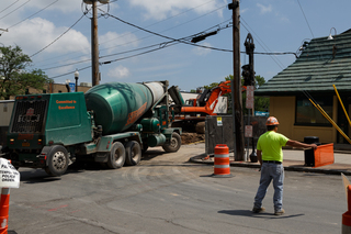 A concrete truck exits the lot that used to be the home of Hungry Chuck's and Funk 'n Waffles. Photo taken July 18, 2017