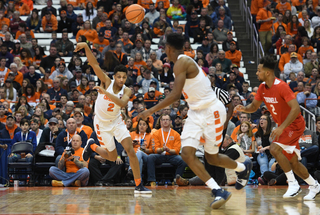 Syracuse forward Matthew Moyer passes the ball down court. Matthew Moyer played 28 minutes, scoring four points and grabbing 10 rebounds.
