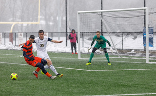 Massimo Ferrin tracks down a ball behind him. He scored the Orange's only goal.