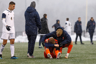 Syracuse forward Severin Soerlie consoles Hagman after the game.