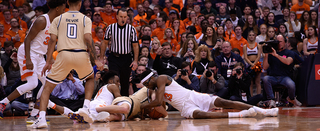 Paschal Chukwu dives on the floor for the ball. He played 15 minutes and had five rebounds and an assist.