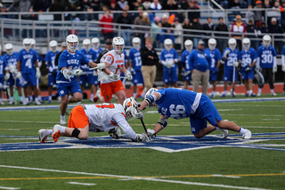 Jakob Phaup battles at the faceoff X. 