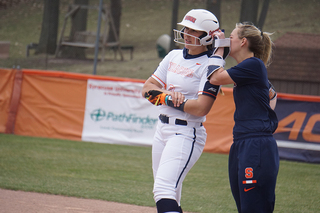 AJ Kaiser speaks with assistant coach Vanessa Shippy