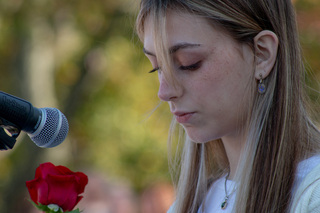 Lockerbie Scholar Natasha Gilfillian takes her turn at the microphone and says a few words about the opportunity to be named a scholar and to represent Lockerbie. Gilfwas the last of the Remembrance and Lockerbie scholars to place a rose on the wall. 