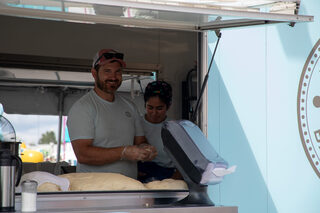 Peachey’s Baking Company is one of the many small food vendors to take up camp at the NY State Fair each year. Owner Dan Peachey worked with his team to produce fresh donuts and soft pretzels throughout the day for fairgoers to enjoy.
